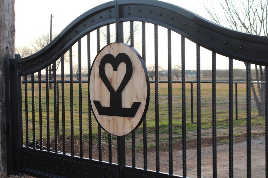 wood accented brand in ranch gate