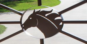 close up racehorse iron gate