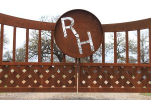braided modern ranch gate with rust patina