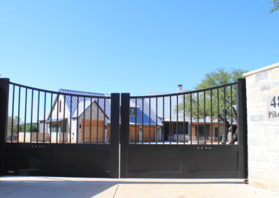 matching set of contemporarary black aluminum driveway gates