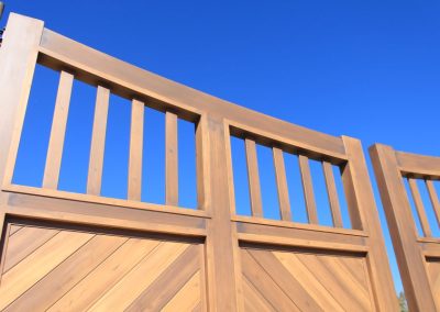 faux-wood-painted aluminum driveway gate