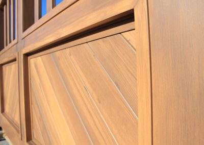 faux-wood-painted aluminum driveway gate