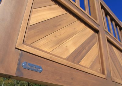 faux-wood-painted aluminum driveway gate