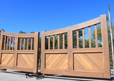 faux-wood-painted aluminum driveway gate