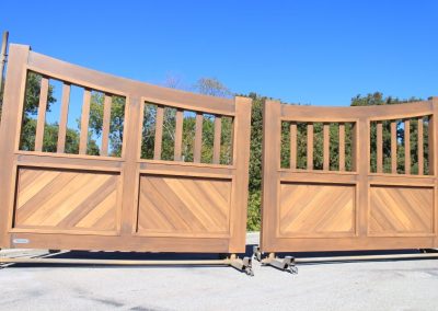 faux-wood-painted aluminum driveway gate