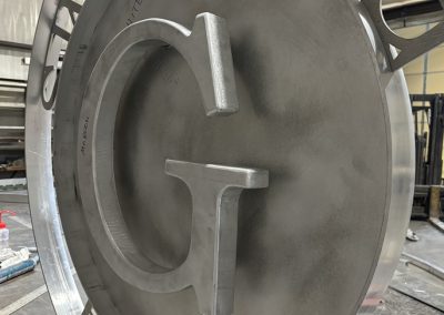 custom fabricated aluminum monogram for ranch gate
